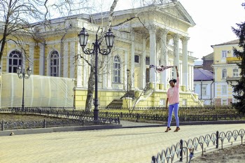 Girl Wearing Pink Long-sleeved Shirt and Blue Pants at Street