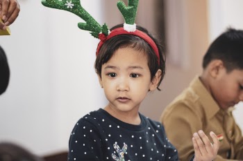 Girl Wearing Reindeer Headband