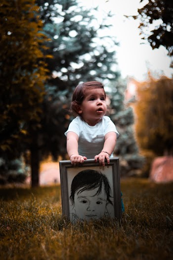 Girl Wearing White Shirt Holding Photo Frame
