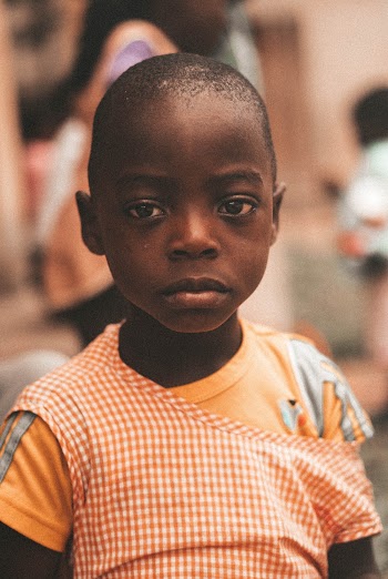 Girl wearing yellow checked dress