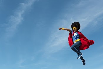 Girl with afro playing superhero | Free Photo - rawpixel