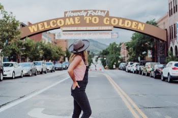 Girl with Hat in road- Golden Colorado