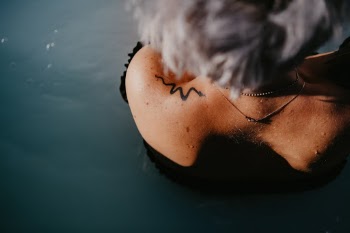 Girl with Snake Tattoo in Blue Lagoon - Reykjavik Iceland