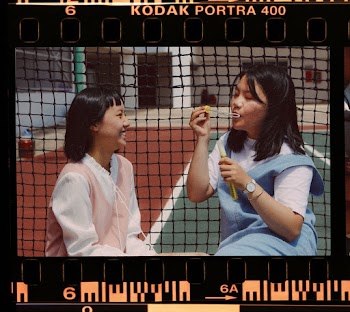 Girls Playing With Blowing Bubbles 