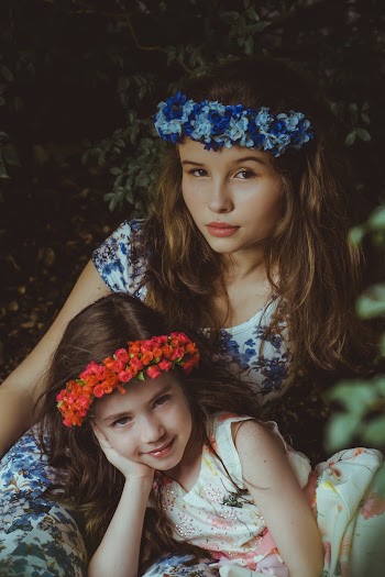 Girls Wearing Blue and Red Flower Headbands
