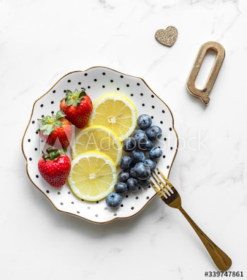 Girly and feminine presentation of plate of colorful fruits