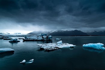 glacier near body of water