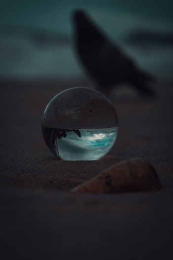 Glass Ball On Sand