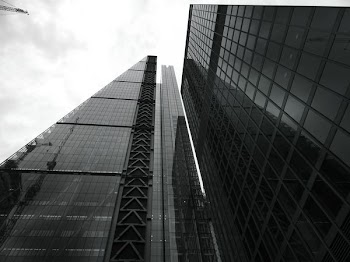 Glass Building Under Gray Sky