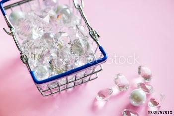 Glass diamonds in a shopping basket