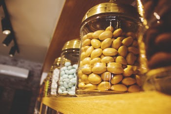 Glass Jar on Brown Wooden Shelf