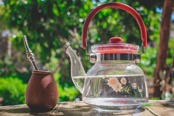 Glass Kettle Near Clay Container