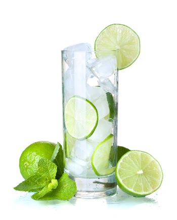 Glass of water with lime, ice and mint. Isolated on white background.