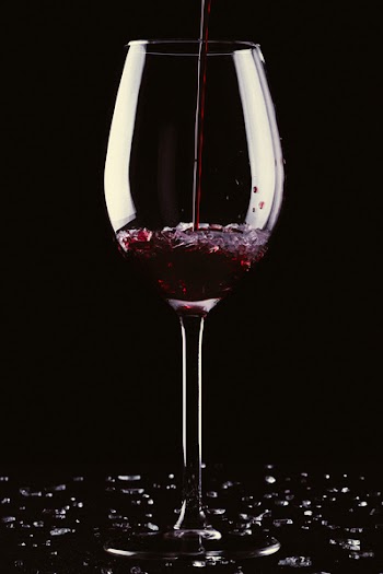 Glass of wine with broken glass