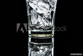 Glass with ice macro shot