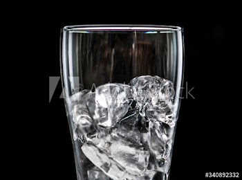 Glass with ice macro shot
