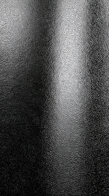 Glossy Black Pebbled Surface Texture