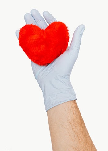Gloved hand holding a fluffy red heart design element | Free  transparent png - 2350876