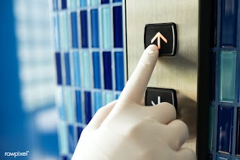 Gloved hand pressing an elevator button to prevent coronavirus contami.. | Free  photo - 2293509