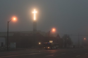 Glowing Cross Through Fog