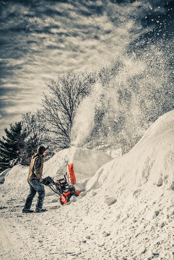 Going for the dramatic ‘going to war’ vibe in this shot.  If you’ve ever had to do this you understand that position.  We’ve got 50 inches of snow in the last 25 Days. Largest month on record.  And yes those driveway drifts are actually that high.

A good usable stock shot for a practice that’s very common this time of year.