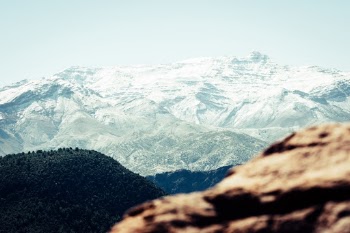 Going through the Atlas mountains I took a couple of shots but wanted to introduce framing. As a result, there's a gradient on framing from the hard rugged rock all the way to the snowy mountains.