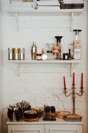 Gold Candelabra on White Wooden Table