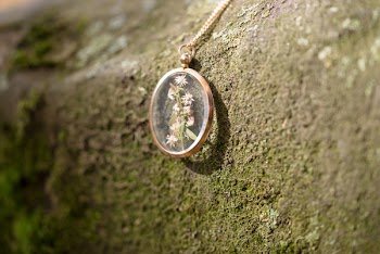 Gold-colored Pendant on Rock