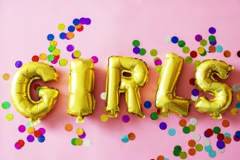 Gold Girls Letter Balloons on Pink Surface