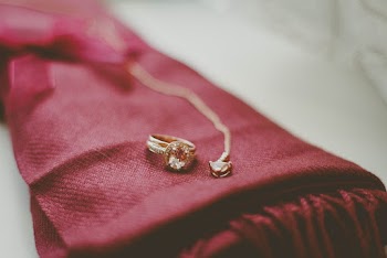 Gold Ring And Necklace On Red Textile