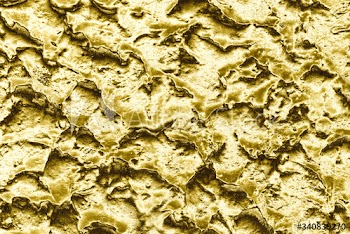 Golden bumpy and rough wall surface