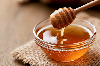 Golden Honey in a Glass Bowl on Burlap