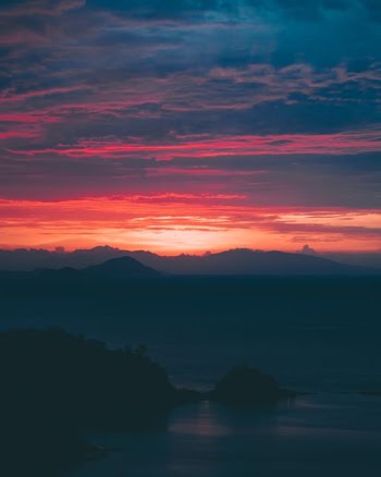 golden hour photo of mountain ranges