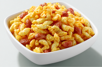 Golden Puffed Rice Snack Mix in Ceramic Bowl