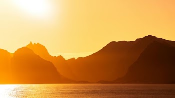 Golden Sunset Over Mountainous Landscape