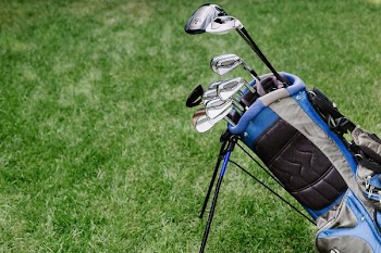 Golf Bag With Clubs At Golf Course