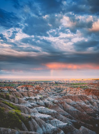 Got up very early to capture this dramatic sunrise across the Badlands in South Dakota.  A storm had just blown through and there are hints of a rainbow in the distance.  Love the balance of detail between the land and the sky.  