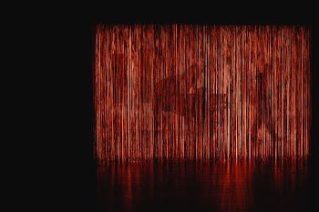 grand piano at the back of red LED light