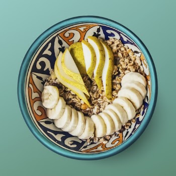 Granola with fruit in a bowl, | Free PSD - rawpixel