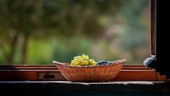 Grapes in Basket on Windowsill