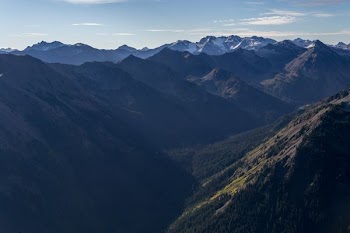 grass covered mountains during daytime