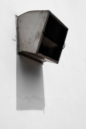 Gray Air Condenser Mounted on White Wall