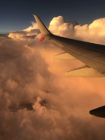 Gray Airplane With Cloudy Sky