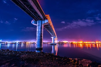 Gray and Black Bridge Overlooking City Buildings