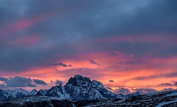 gray and black mountain at sunset