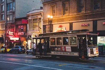 Gray and Black Tram during Night Time