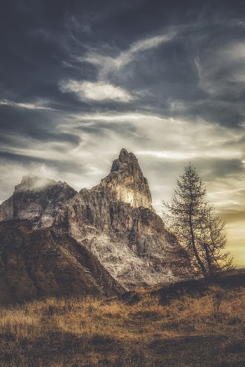 Gray and Brown Mountain Range Under White and Gray Sky