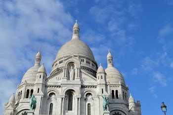Gray and White Cathedral Under Cloudy Blue Sky