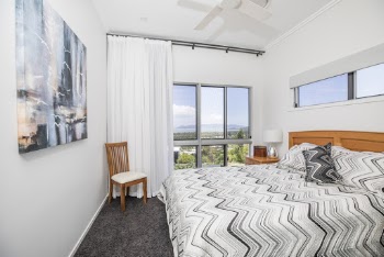 Gray and White Chevron Printed Bed With White Painted Wall