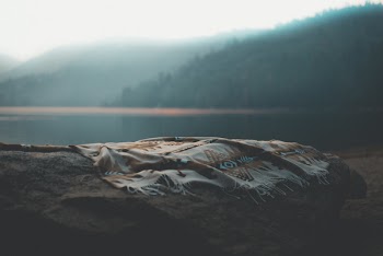 Gray and White Scarf on Stone